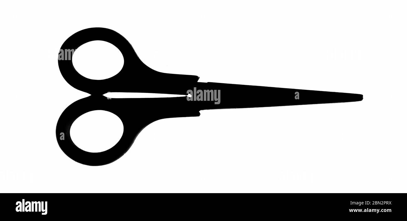 one pair of closed scissors in silhouette, on a white background Stock Photo