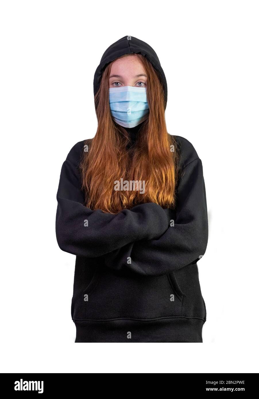 teenage girl wearing a medical mask  for protection against corona virus and other health problems on a white isolated background, teen has a black ho Stock Photo