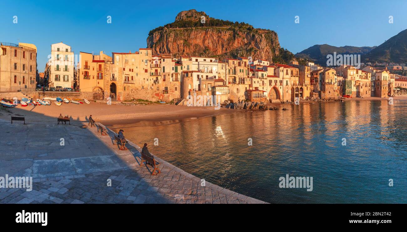 Beautiful panoramic view of coastal city Cefalu at sunset, Sicily, Italy Stock Photo