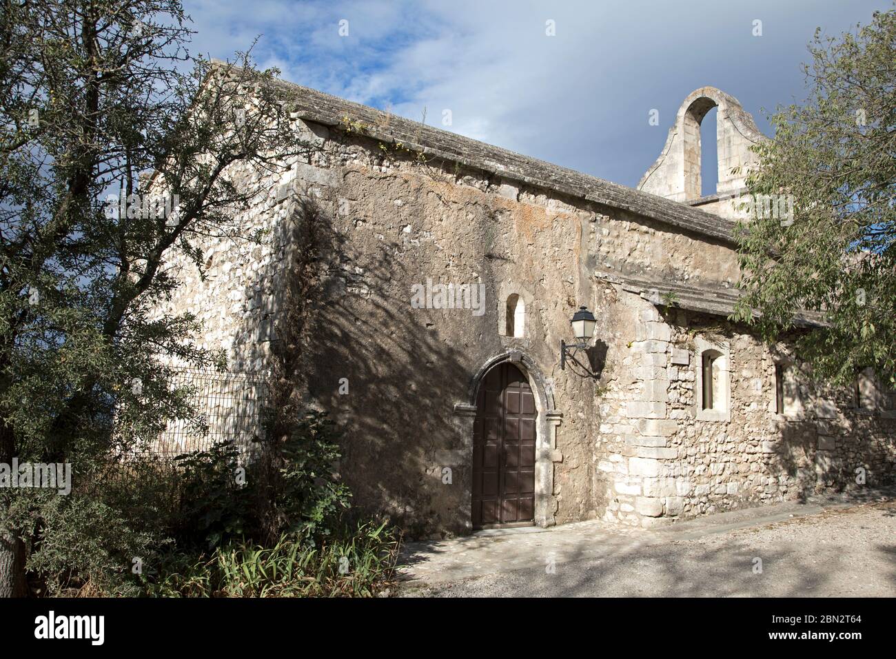 The 12th Century Église St-Laurent at the village of Eygalières in the Alpilles Bouches du Rhône France Stock Photo