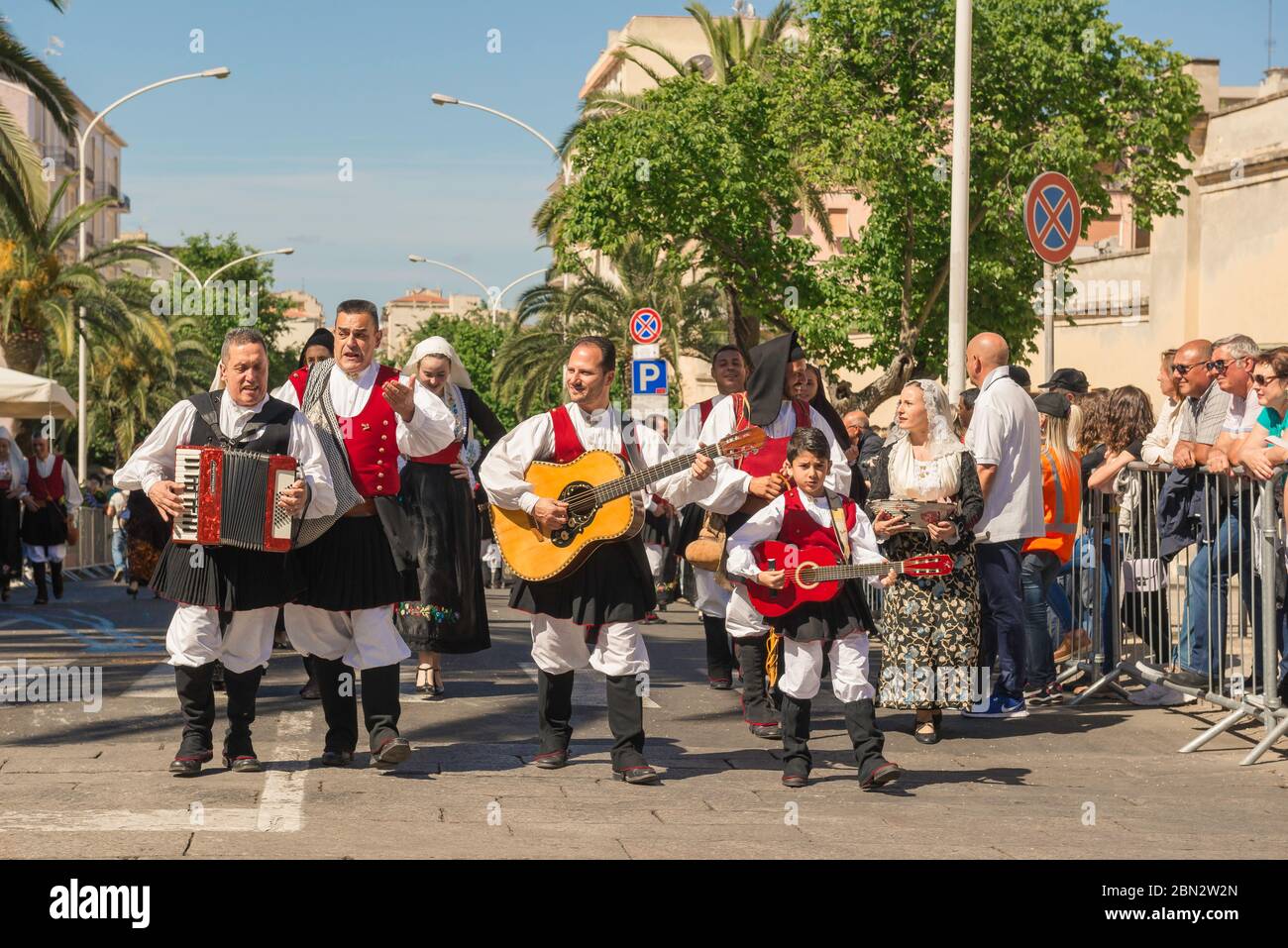 Sardinia festival, a group of musicians in Sardinian traditional dress participate in the grand procession during the Cavalcata festival in Sassari. Stock Photo