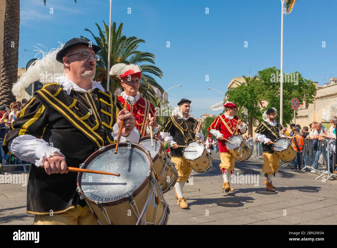 Sardinia festival, view of a group of drummers in Sardinian traditional dress  marching in the grand procession during Cavalcata in Sassari, Sardinia. Stock Photo