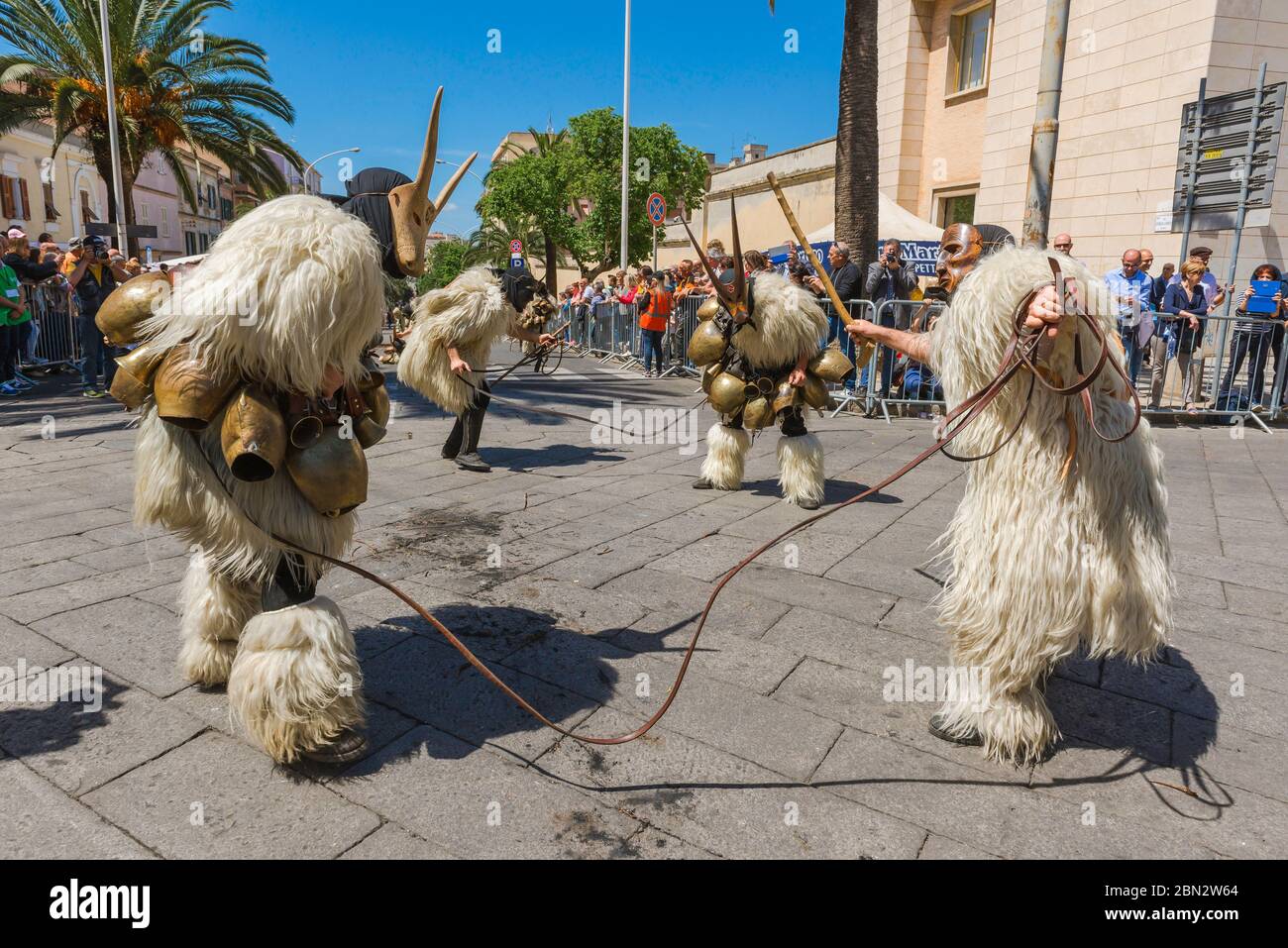 Sardinia festival, men dressed as Boes and Merdules - traditional  figures in sheepskins and masks, participate in the Cavalcata festival, Sassari Stock Photo