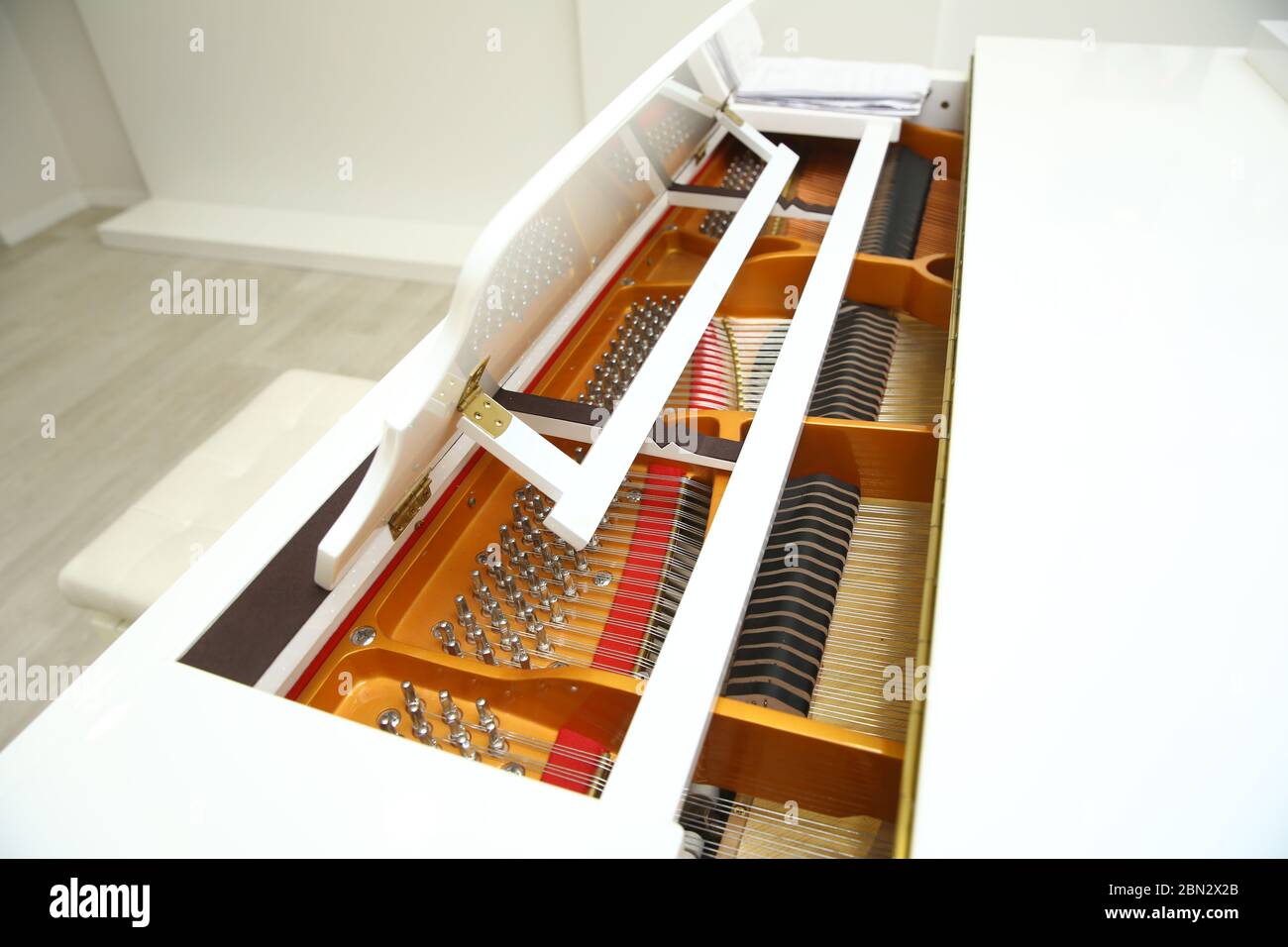 Music playing from the ancient ruined piano . Hammers in abandoned