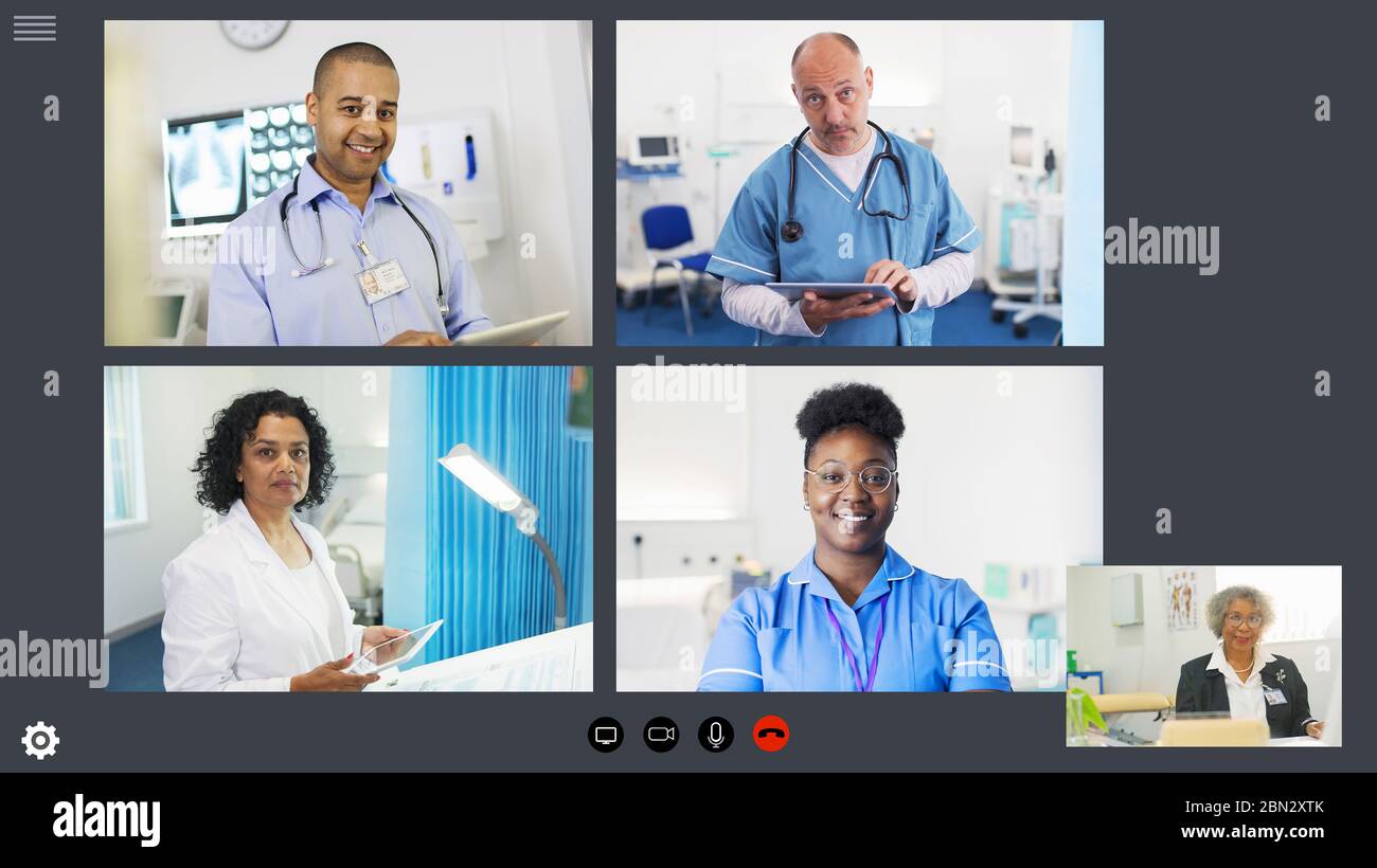 Doctors and nurse video conferencing during COVID-19 pandemic Stock Photo
