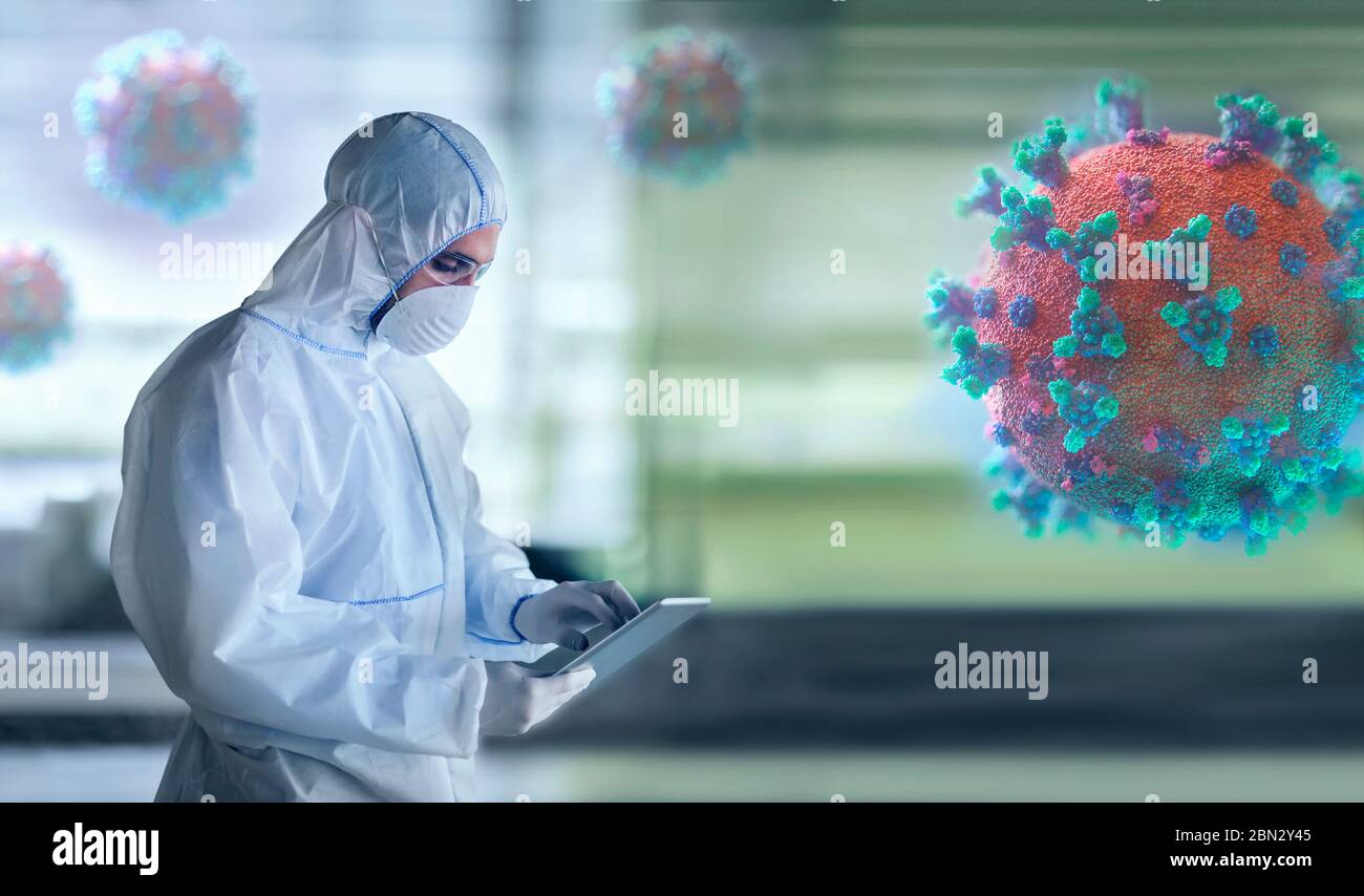 Scientist in clean suit researching coronavirus in laboratory Stock Photo