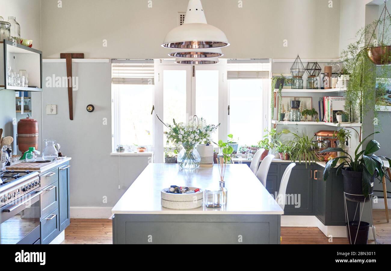 Pendant lights over domestic kitchen island Stock Photo