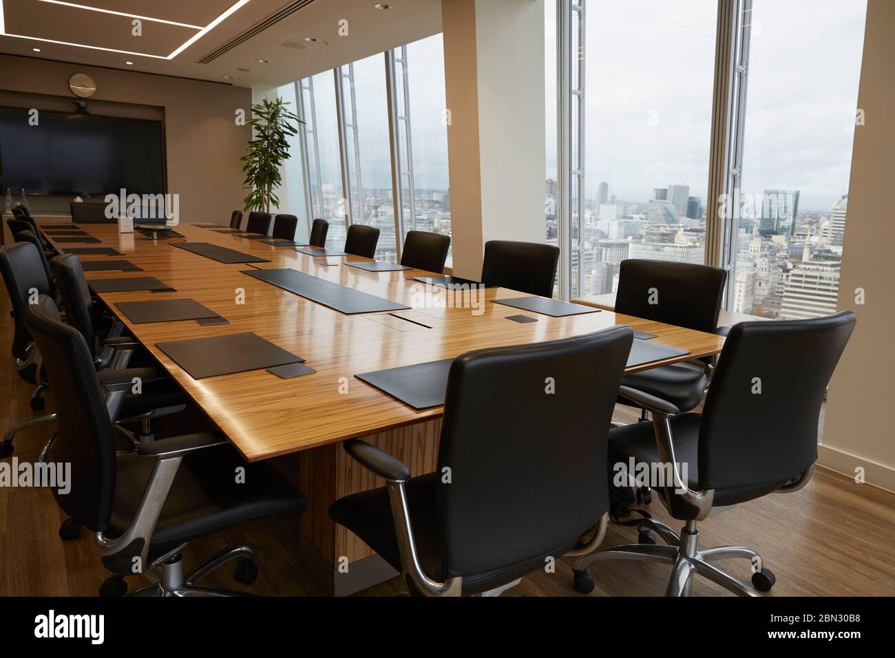 Modern conference room table overlooking city Stock Photo