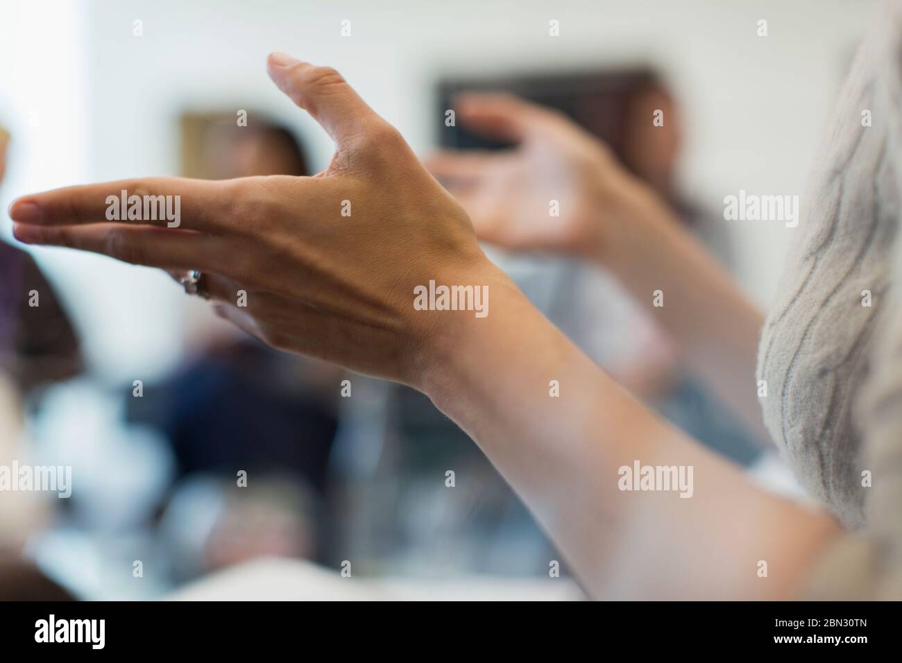 Close up businesswoman gesturing in meeting Stock Photo