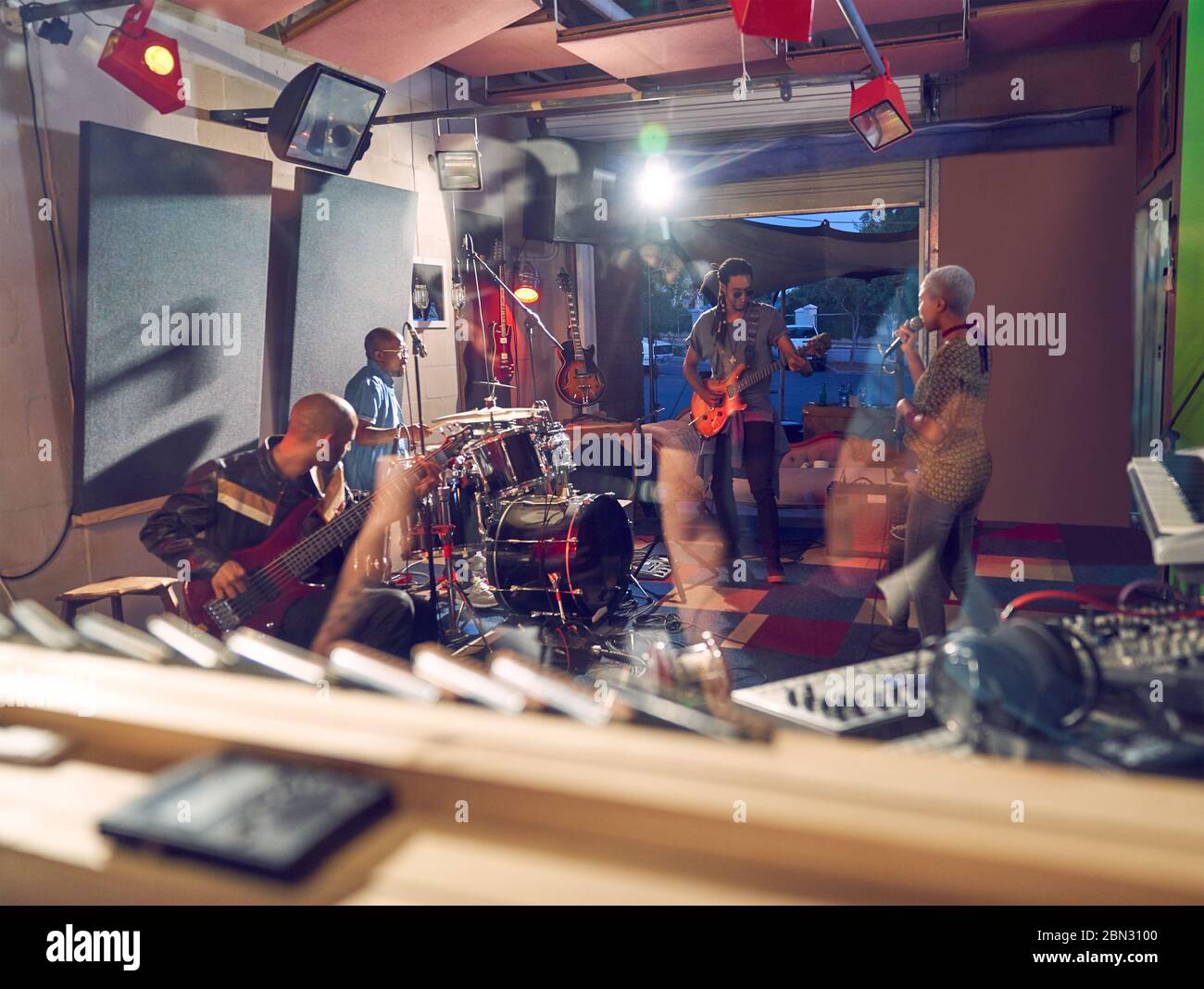 Musicians practicing in recording studio Stock Photo - Alamy