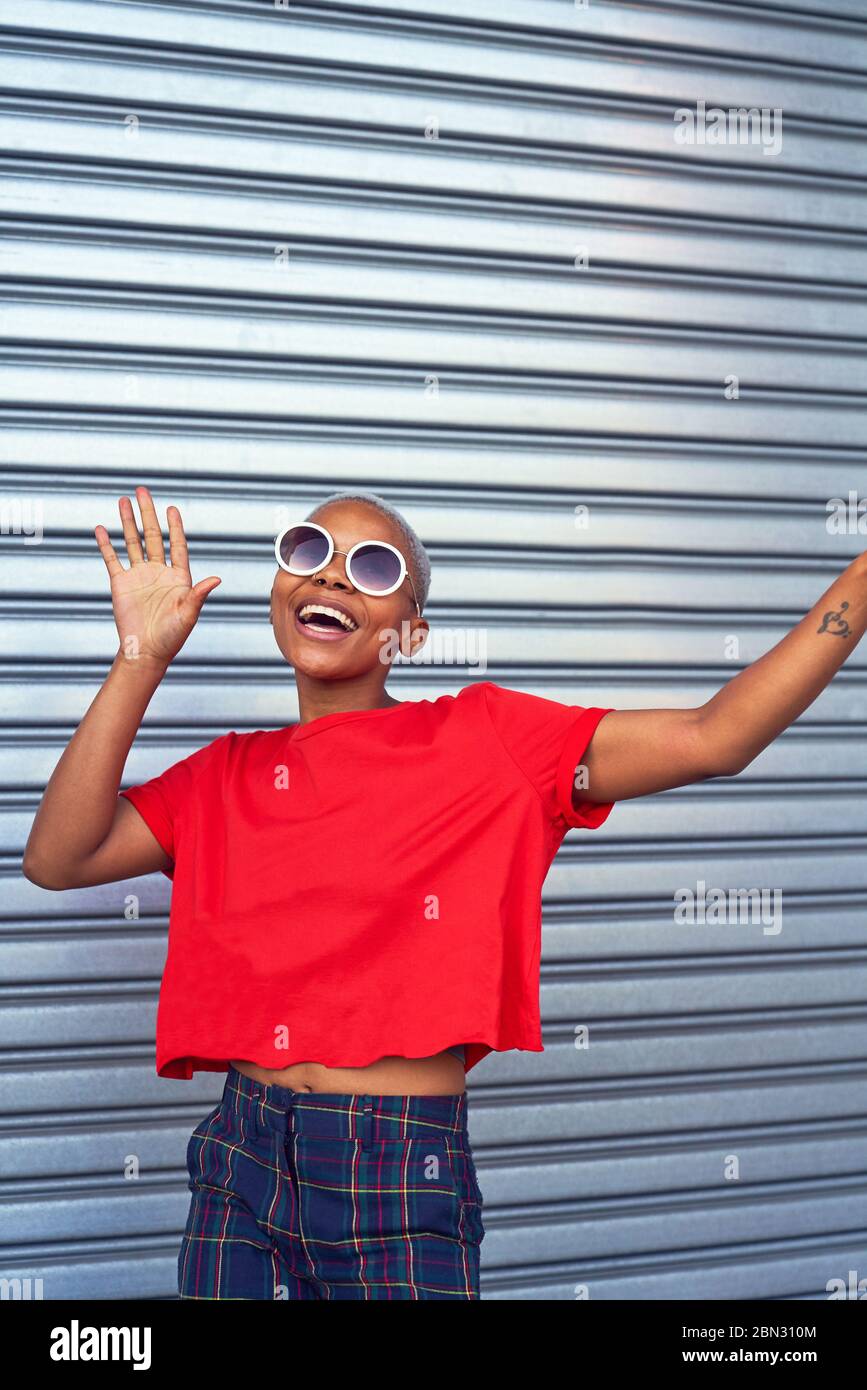 Portrait carefree young woman in sunglasses Stock Photo
