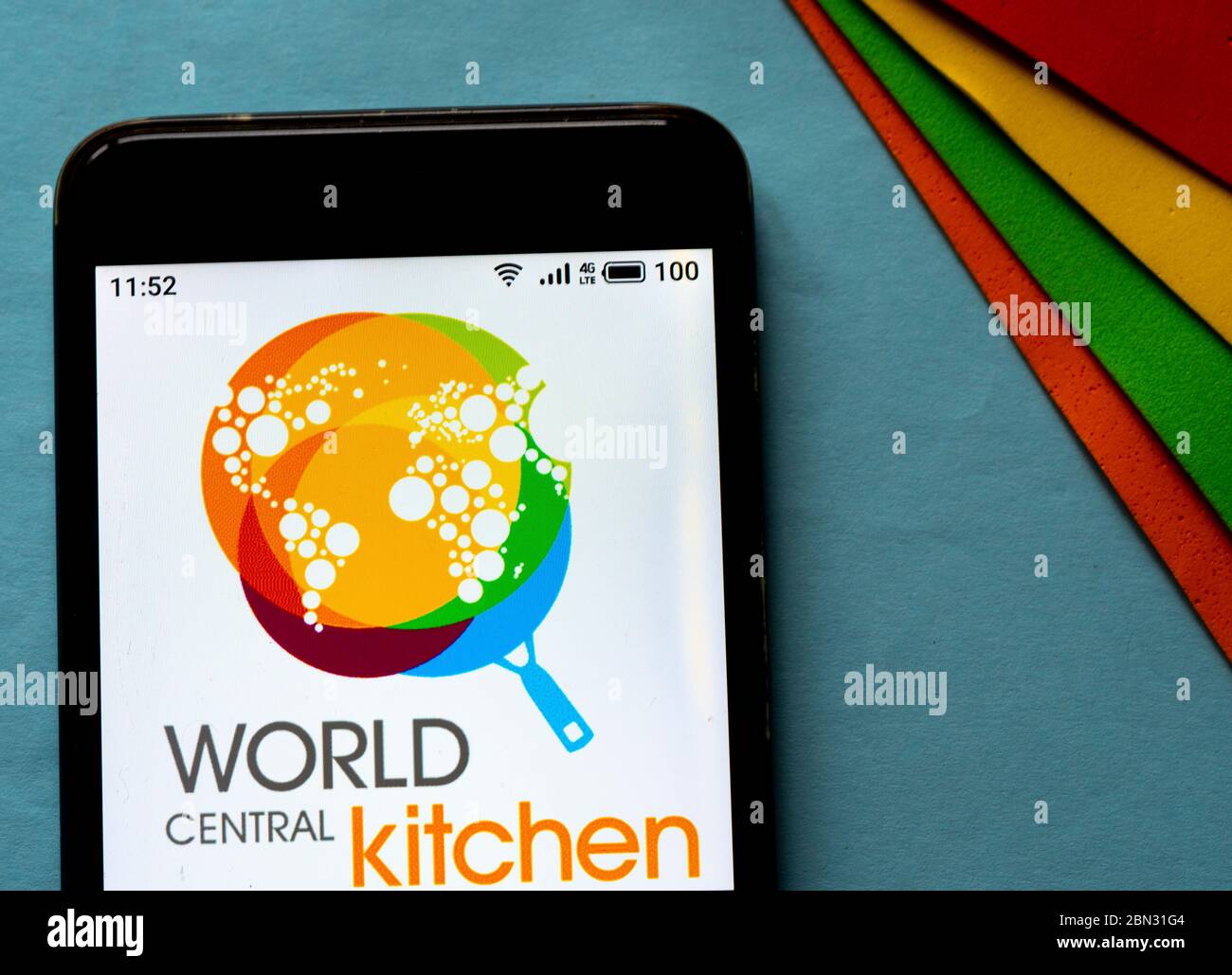 In this photo illustration a World Central Kitchen logo seen displayed ...