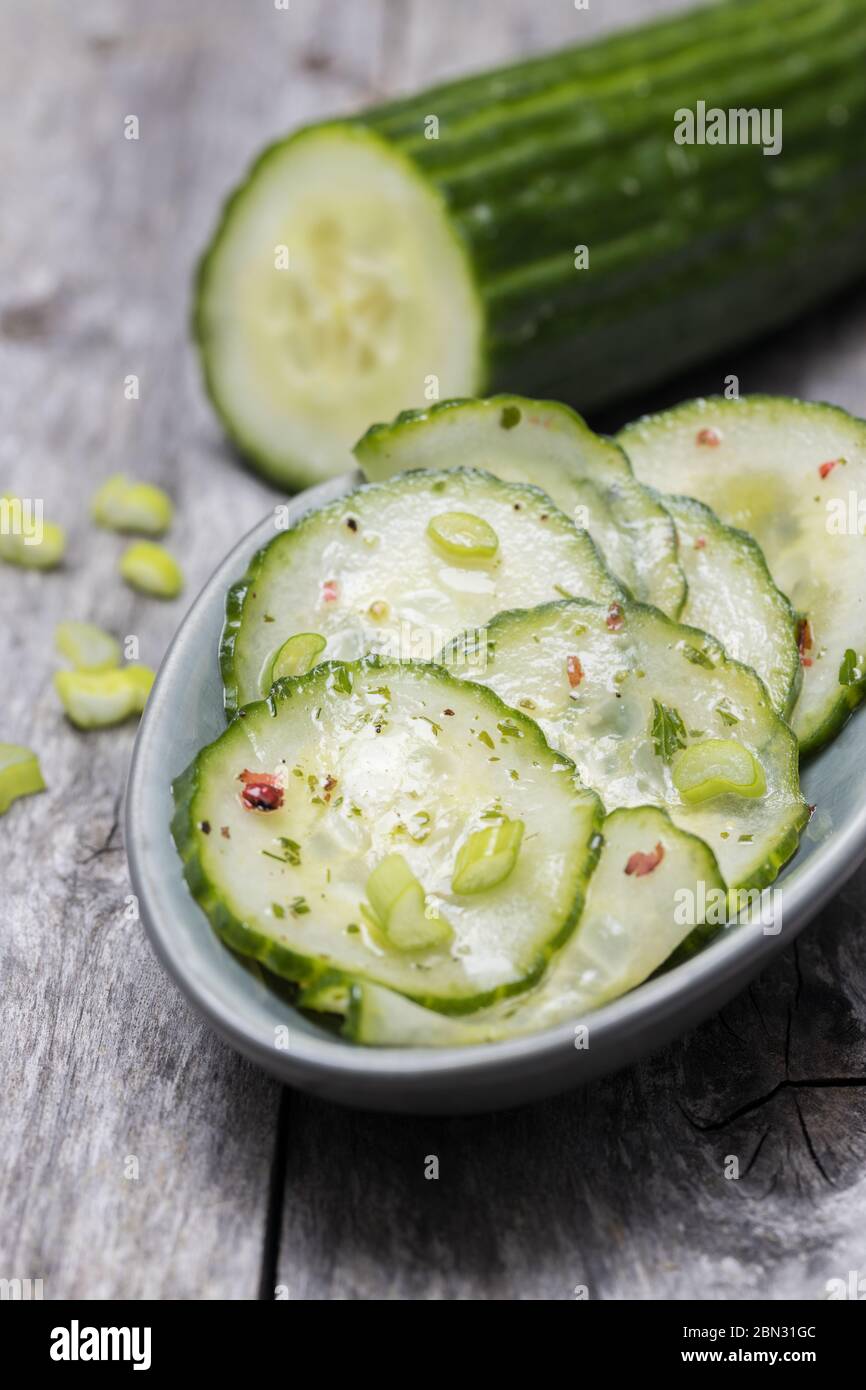 Cucumber salad with spring onion and pink pepper Stock Photo Alamy