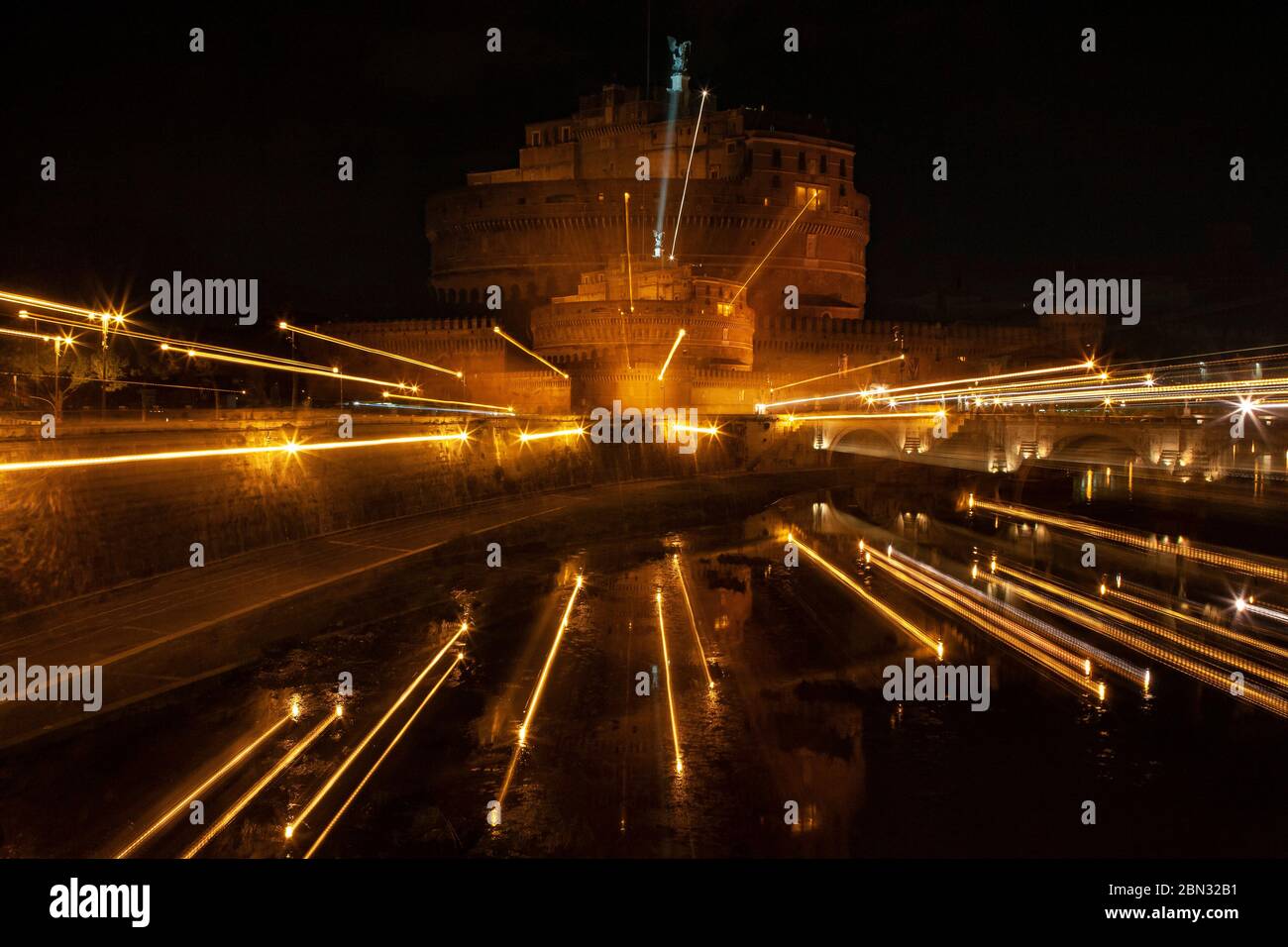 Zoomed nocturnal photograph of the Castel Sant'Angelo, Rome, with double image and zoomed light streaks Stock Photo