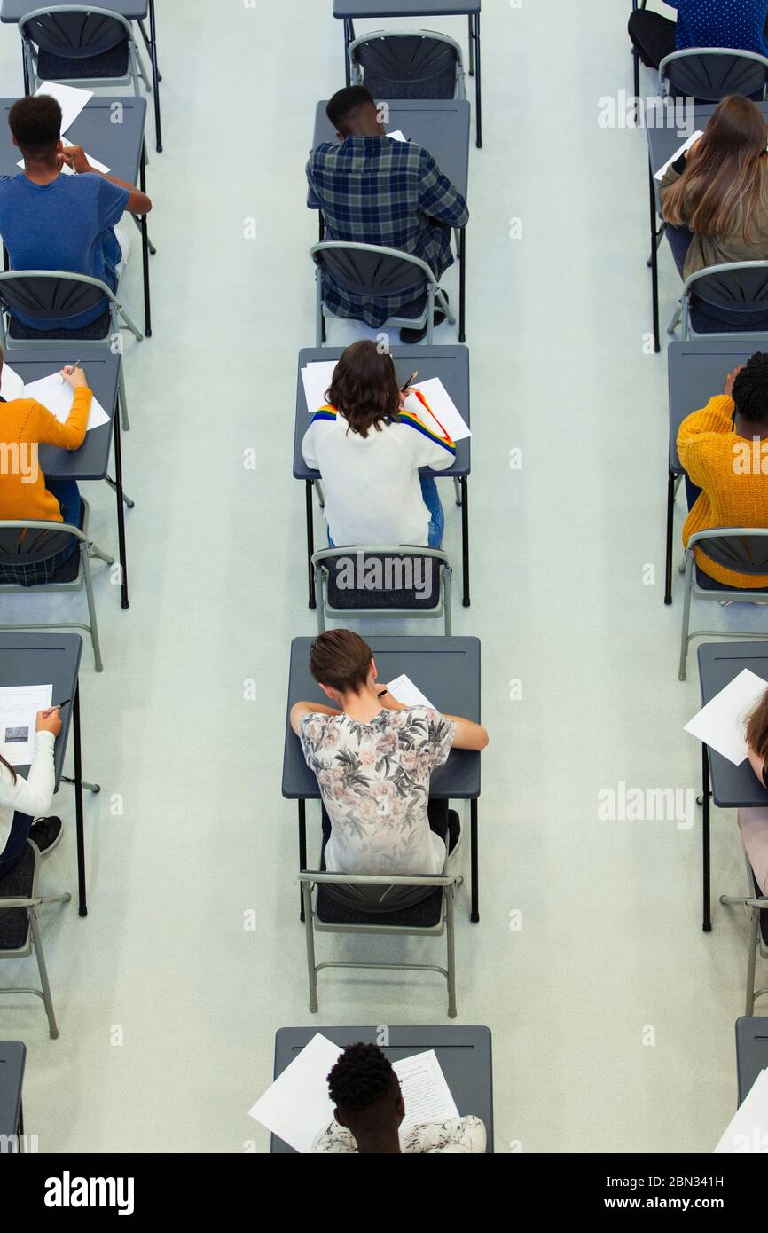 View from above high school students taking exam at desks in classroom Stock Photo
