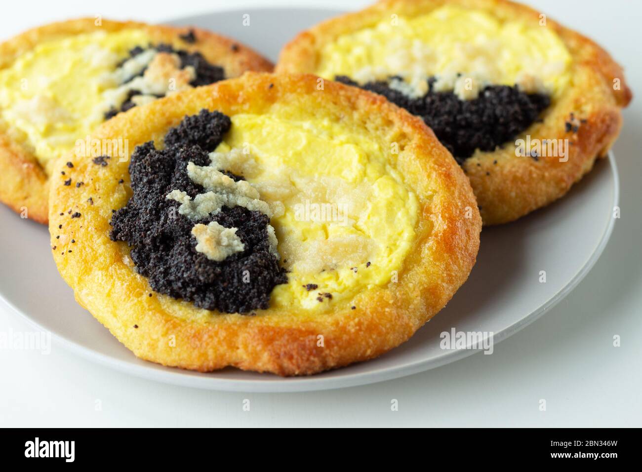 Traditional Czech kolache. Butter baking with cottage cheese and poppy