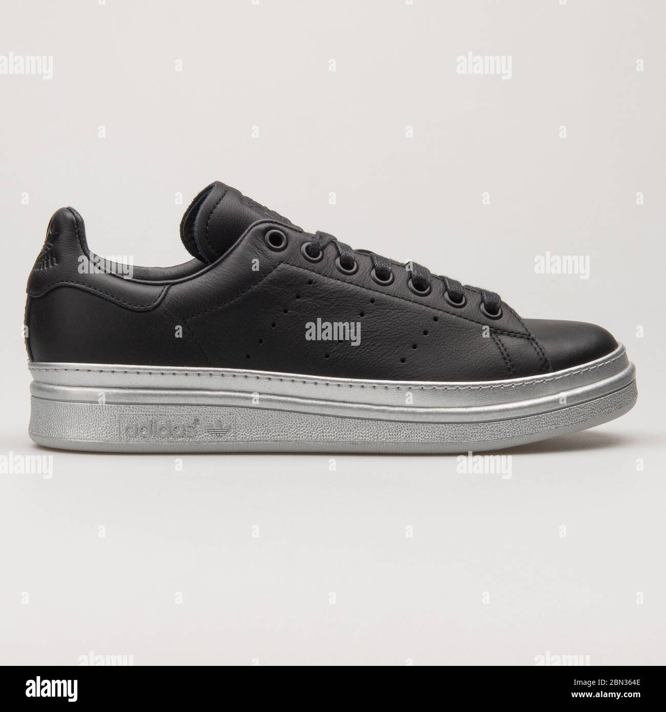 VIENNA, AUSTRIA - AUGUST 13, 2018: Adidas Stan Smith Bold black and silver sneaker on white background. Stock Photo