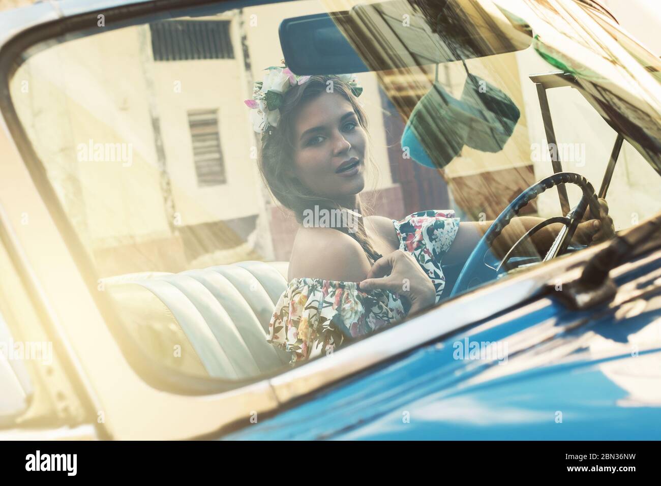 Beautiful woman during driving a retro car Stock Photo - Alamy