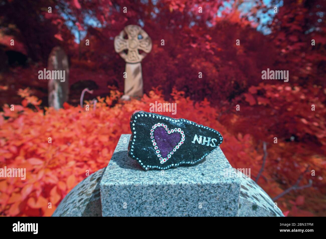 NHS Decorated Pebble and Celtic Cross, Gulval, Cornwall UK Stock Photo