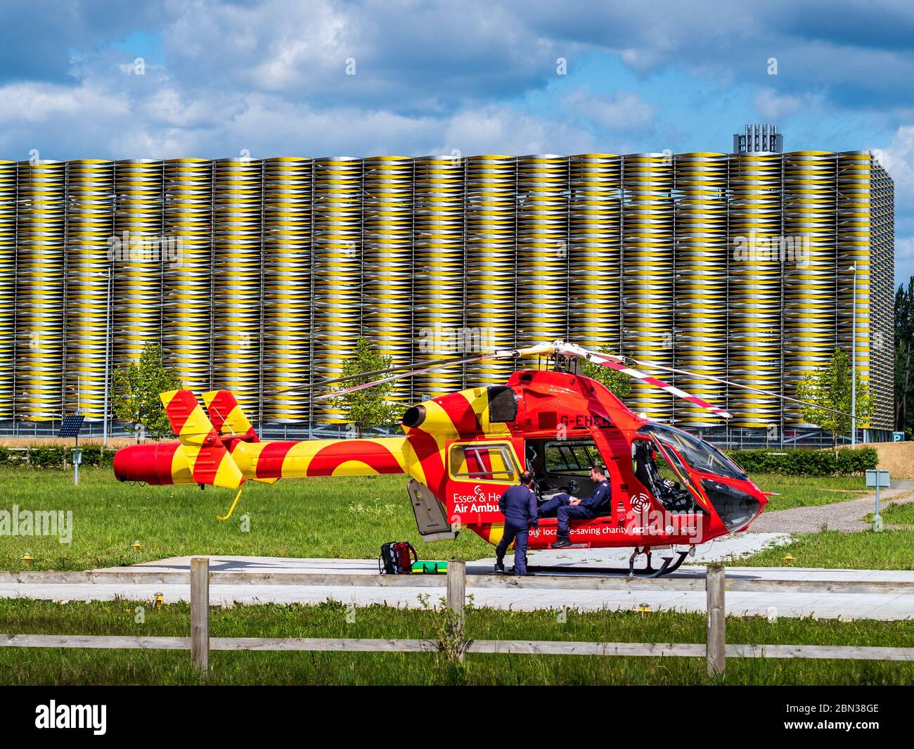 Helicopter Air Ambulance Cambridge. The  Essex & Herts Air Ambulance waits at Cambridge Addebrookes Hospital Helipad. McDonnell Douglas MD902 Explorer. Stock Photo