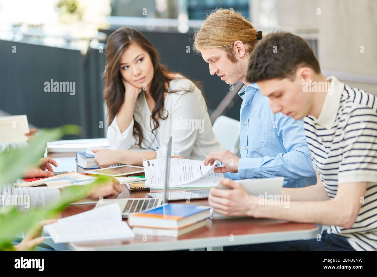 Group of students study together for an exam at the university Stock Photo