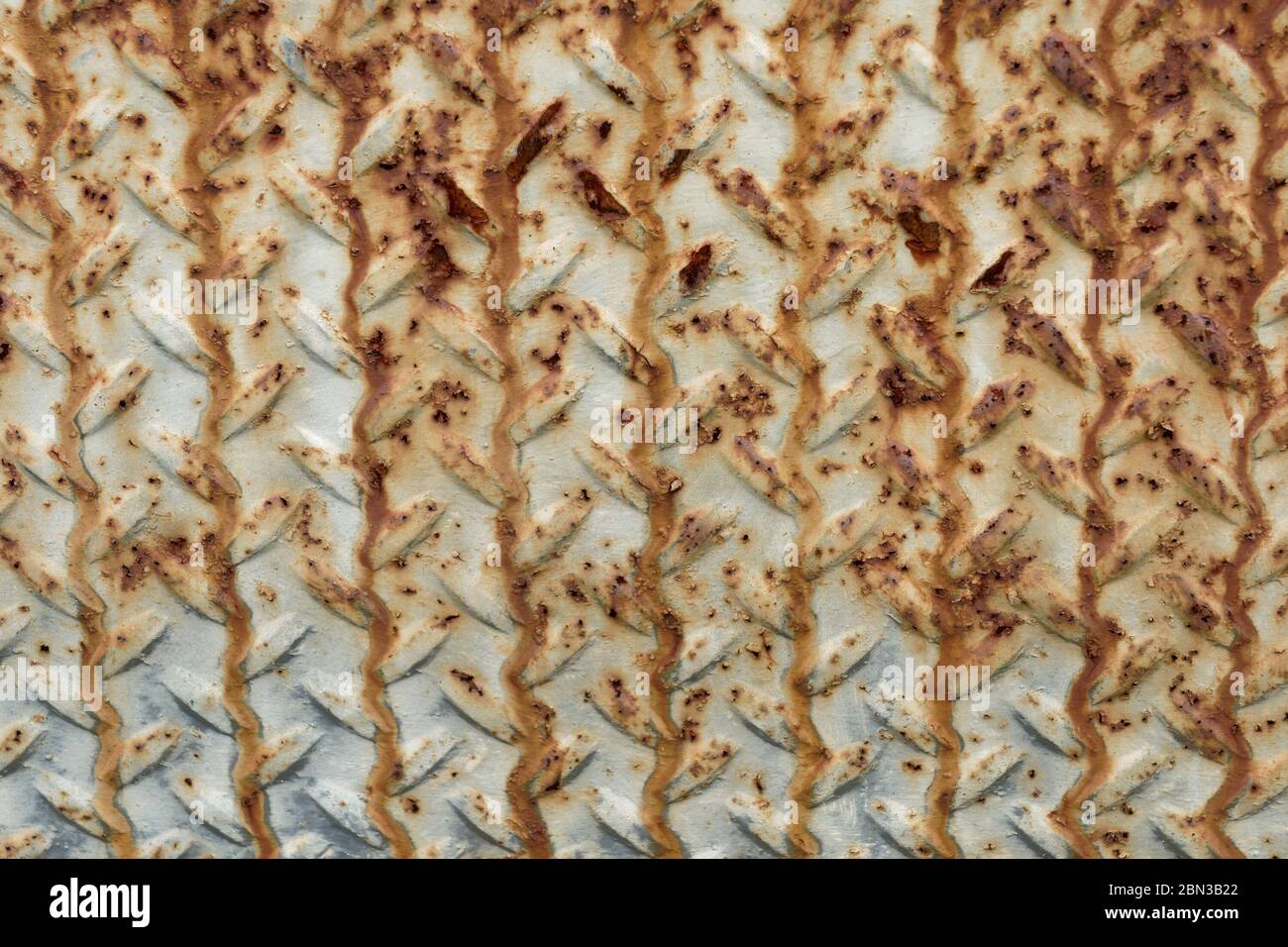 metal diamond plate with rusty texture Stock Photo