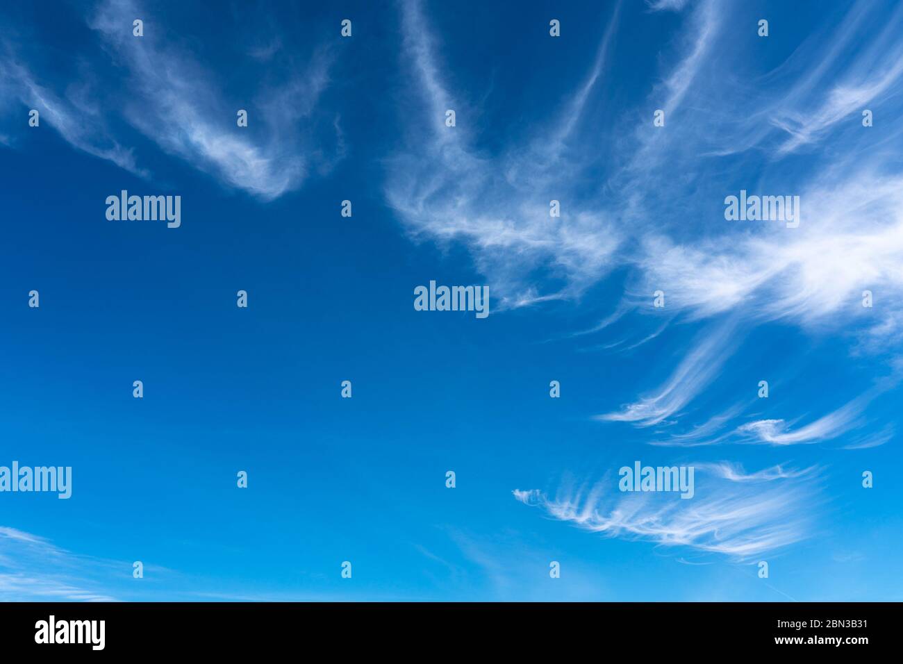 whispy white clouds in a aqua blue sky near Tucson Arizona Stock Photo