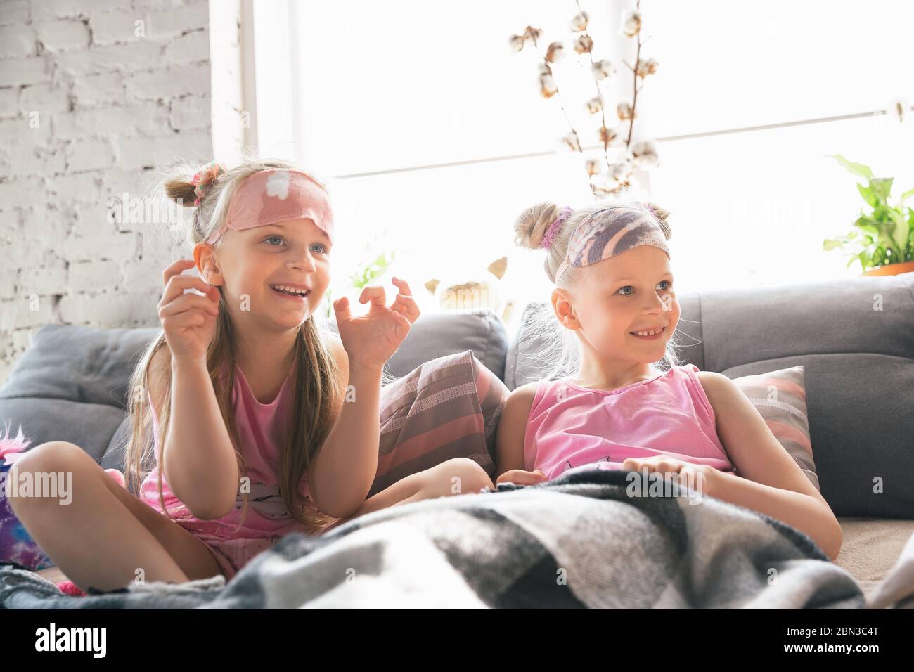 Quiet Little Girls Waking Up In A Bedroom In Cute Pajamas Home Style And Comfort Cute Caucasian Girls In Early Morning Sweet Dreams Concept Of Childhood Happiness Friendship Pajamas Party Stock Photo