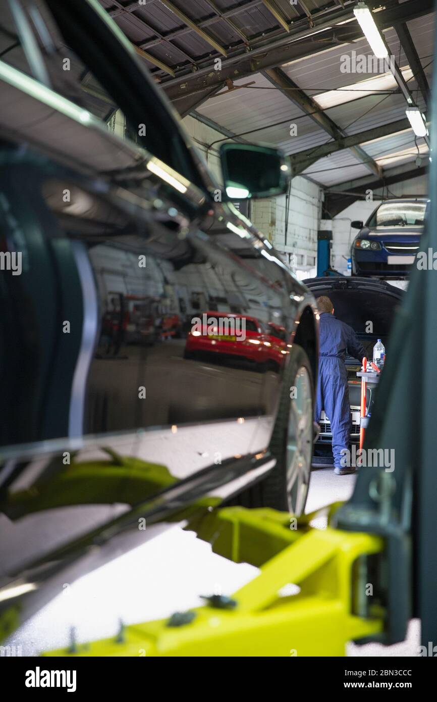 Mechanic working in auto repair shop Stock Photo