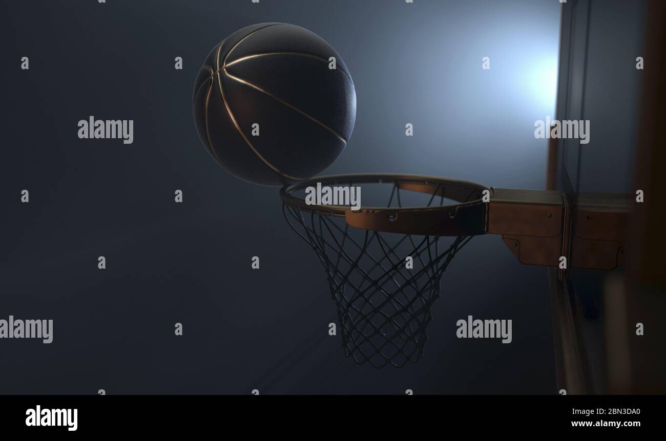 An action shot of a black and gold basketball teetering on the rim of a