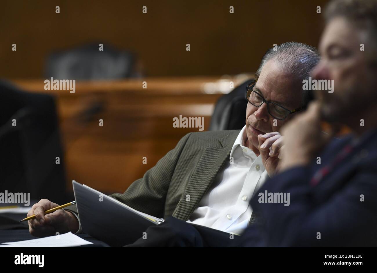 Washington, United States. 12th May, 2020. U.S. Senator Mike Braun (R-IN) takes notes as he listens to testimony during the Senate Committee for Health, Education, Labor, and Pensions hearing to examine COVID-19 and Safely Getting Back to Work and Back to School on Tuesday, May 12, 2020, on Capitol Hill in Washington, DC. Pool Photo by Toni L. Stock Photo