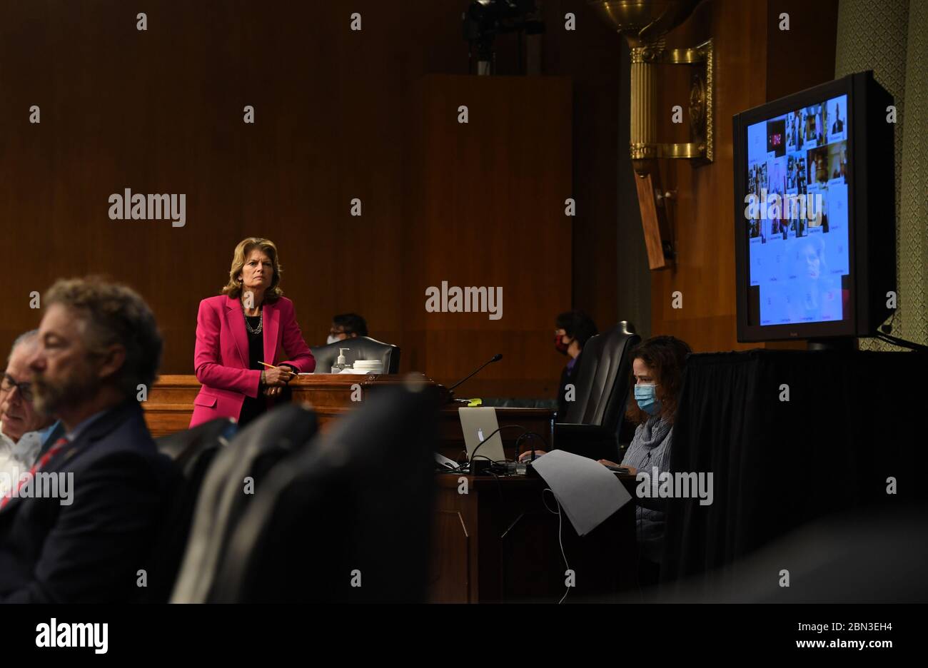 Washington, United States. 12th May, 2020. U.S. Senator Lisa Murkowski (R-AK) stands to get a better view of Dr. Anthony Fauci's video testimony during the Senate Committee for Health, Education, Labor, and Pensions hearing to examine COVID-19 and Safely Getting Back to Work and Back to School on Tuesday, May 12, 2020, on Capitol Hill in Washington, DC. Pool Photo by Toni L. Stock Photo