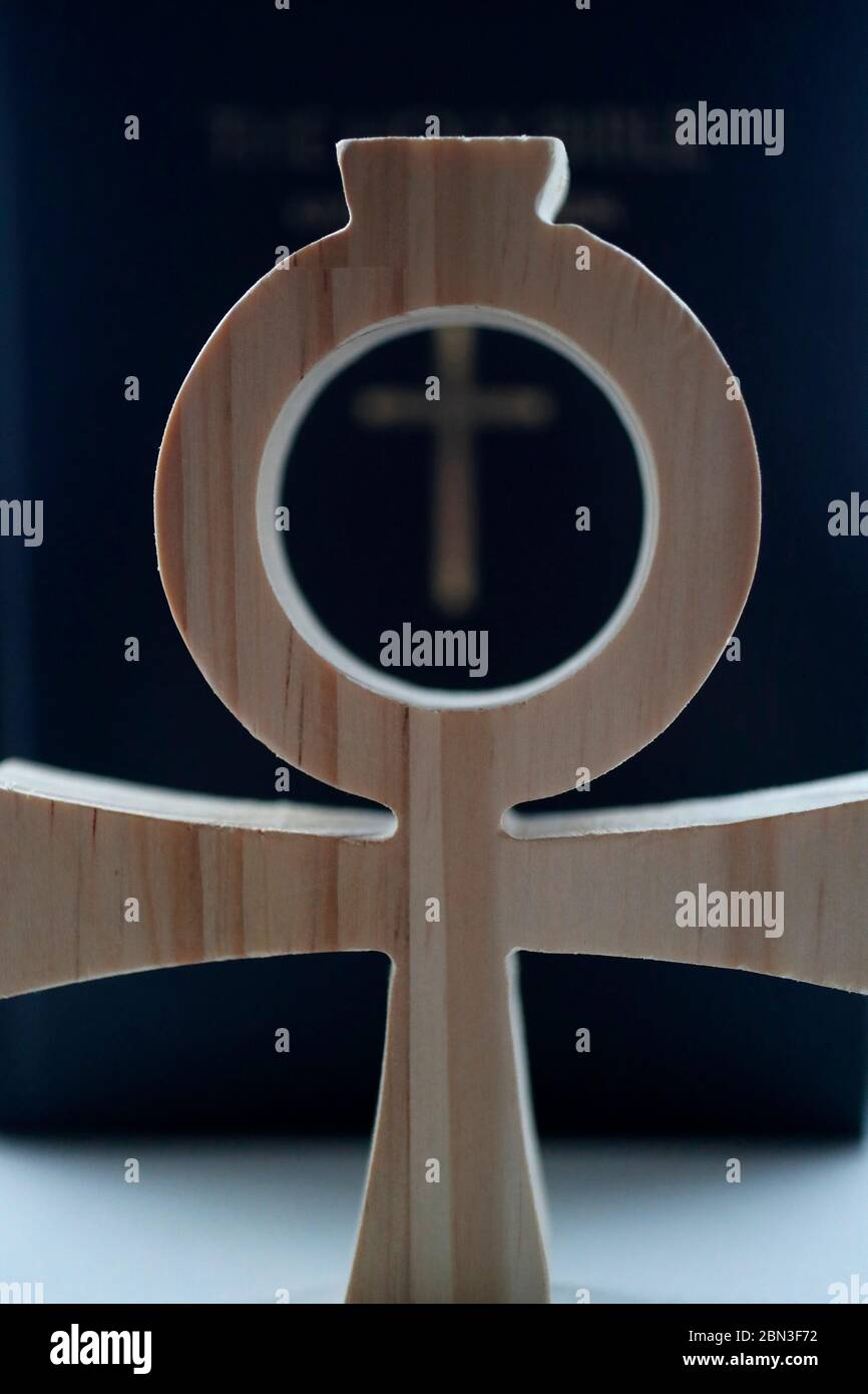 Bible and the Ankh, symbol from ancient Egypt, known as the key of life