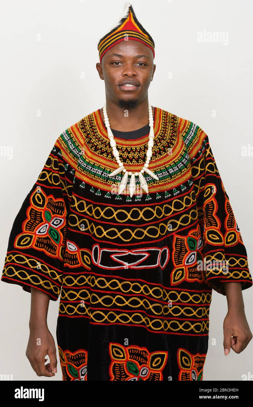 Happy young handsome African man wearing traditional clothing Stock Photo
