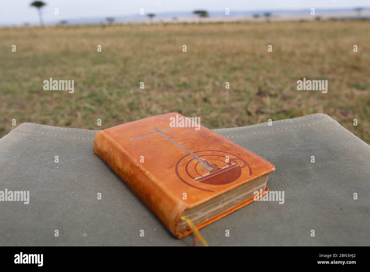 Bible on a safari folding chair. Masai Mara. Kenya Stock Photo Alamy