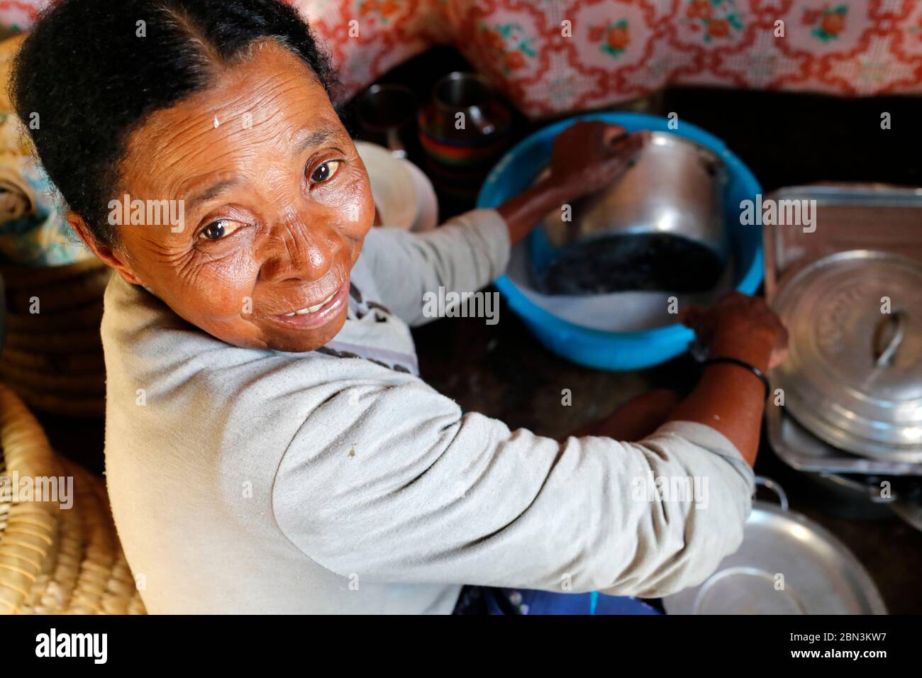 Malagasy woman working in kitchen.  Portrait.  Madagascar. Stock Photo
