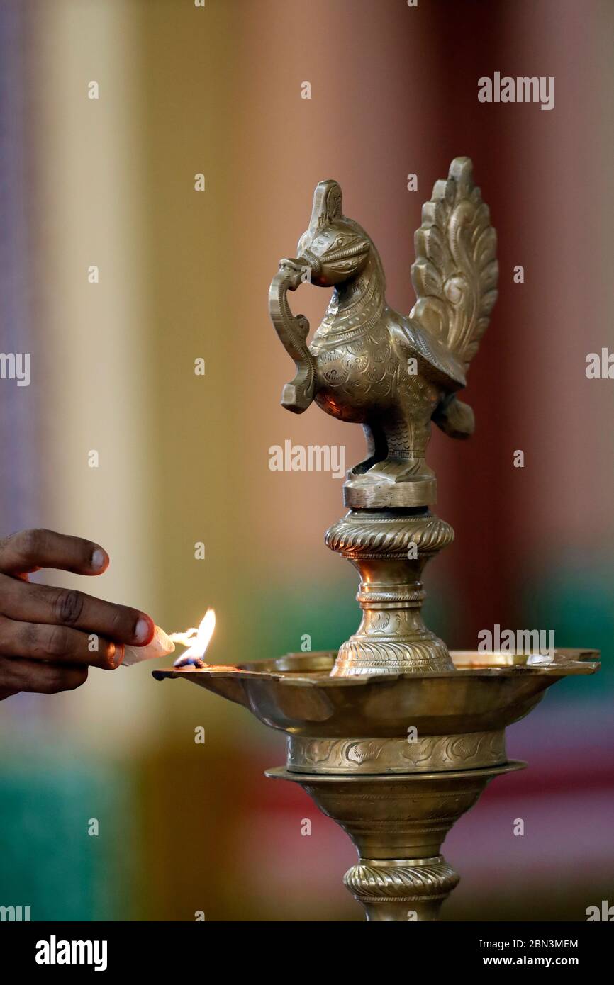 Sri Mahamariamman Hindu Temple. Peacock Brass Oil Wick Diya or Oil Lamp