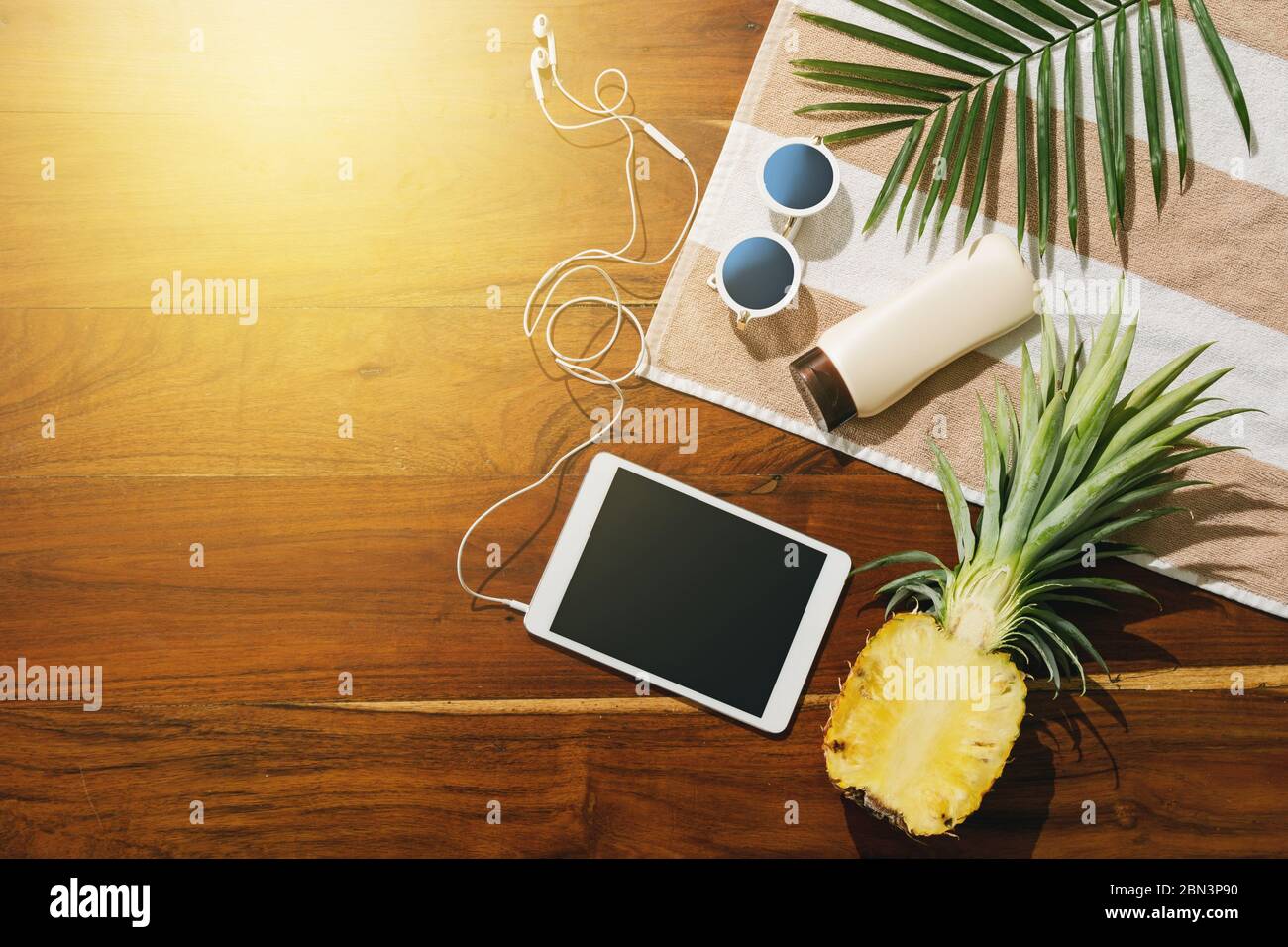 Different items for beach vacations on wooden background. Stock Photo