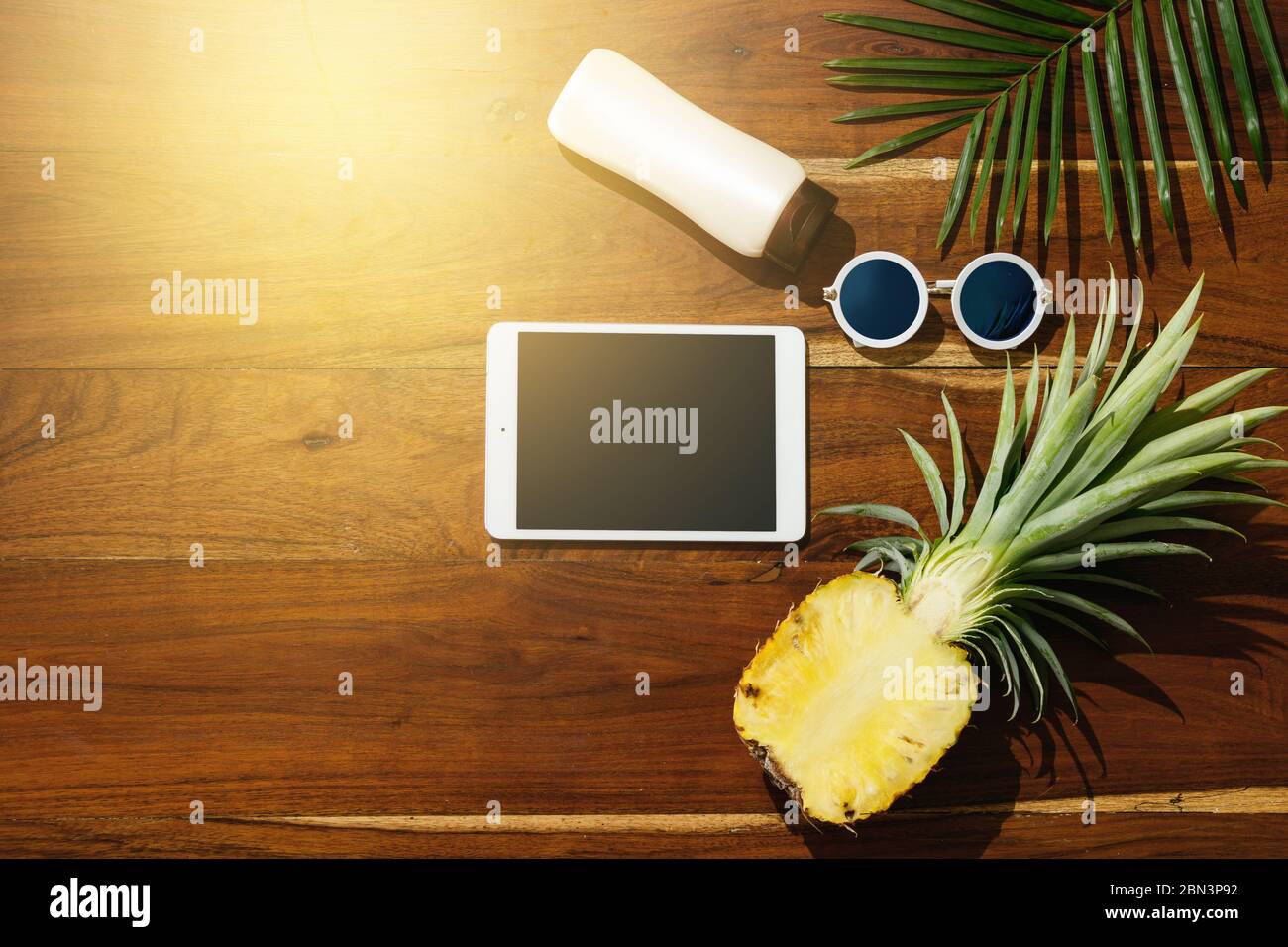 Different items for beach vacations on wooden background. Stock Photo