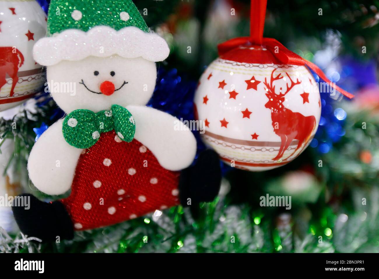 Decoration at christmas market. Snowman toy and ball. Stock Photo