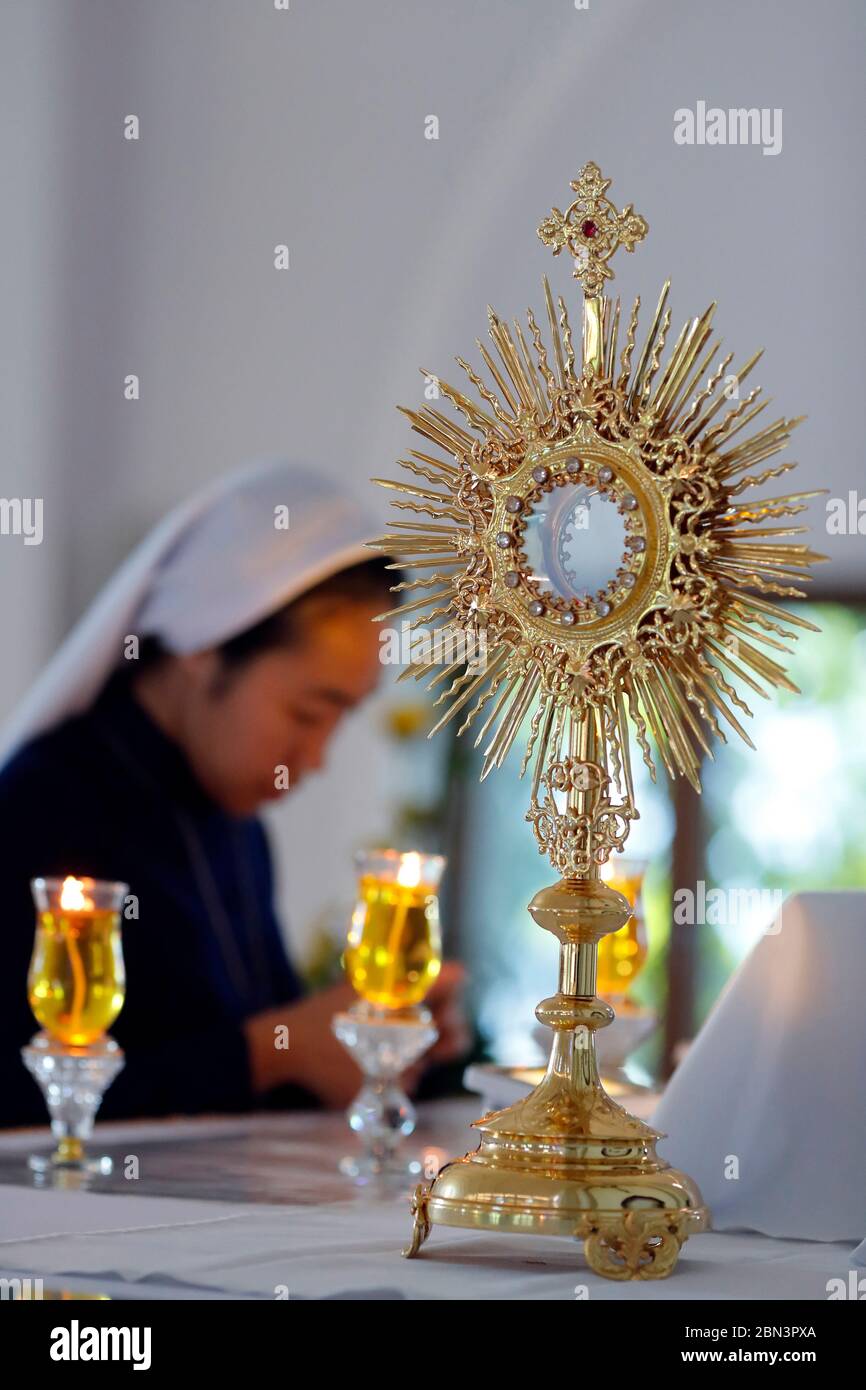 Catholic church. Eucharist adoration. Monstrance on altar. Vietnam