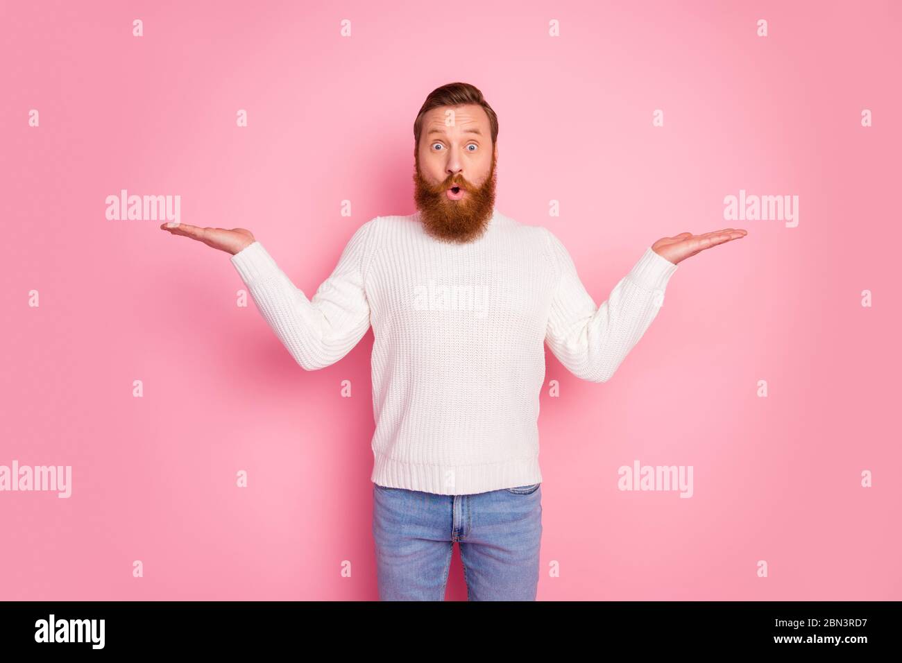 Portrait Of His He Nice Attractive Funny Amazed Cheerful Cheery Red Guy Holding Copy Space On Palm Deciding Choosing Solution Isolated Over Pink Stock Photo Alamy