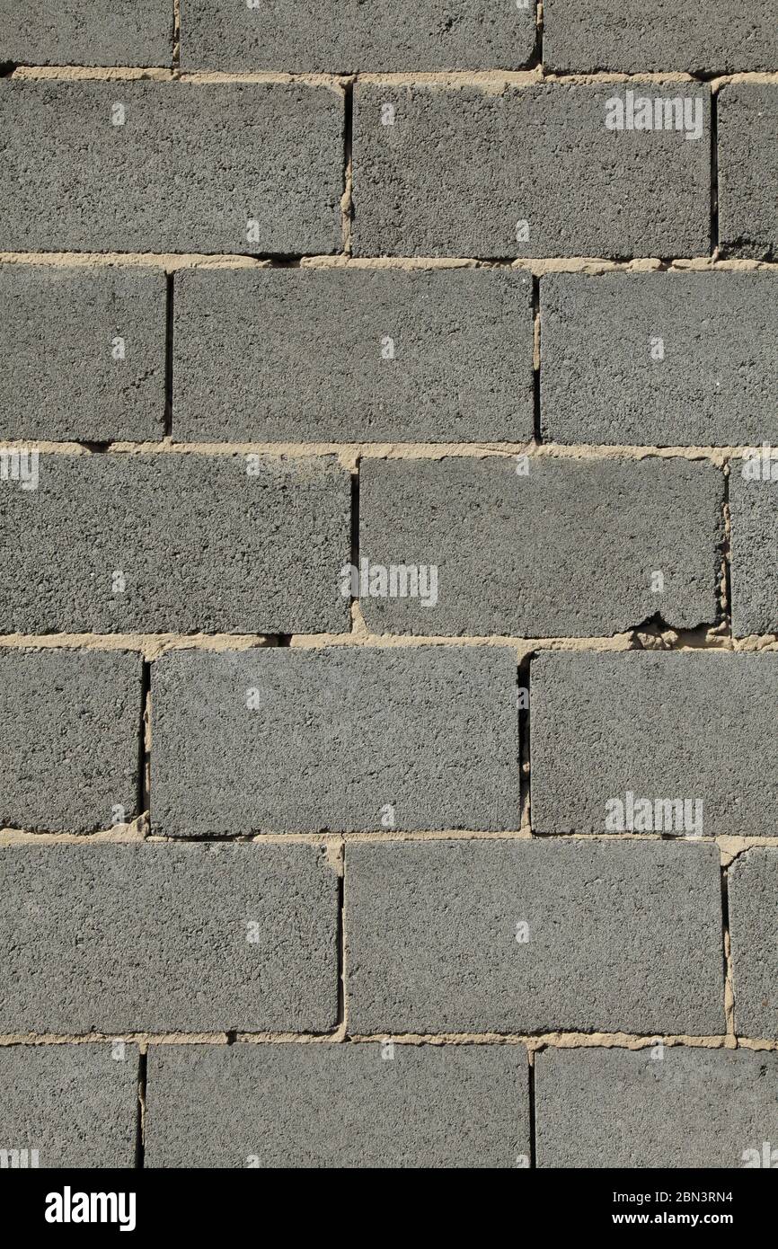 Slag (cinder) blocks or expanded brickwork. Grey wall, texture and background. Slag bricks in building for light but non-residential premises Stock Photo