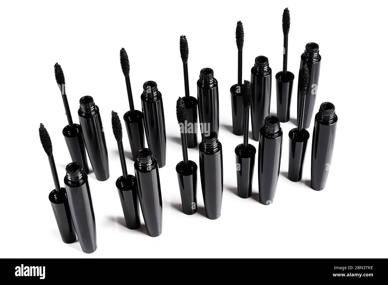 Mascara brushes and containers on white background Stock Photo