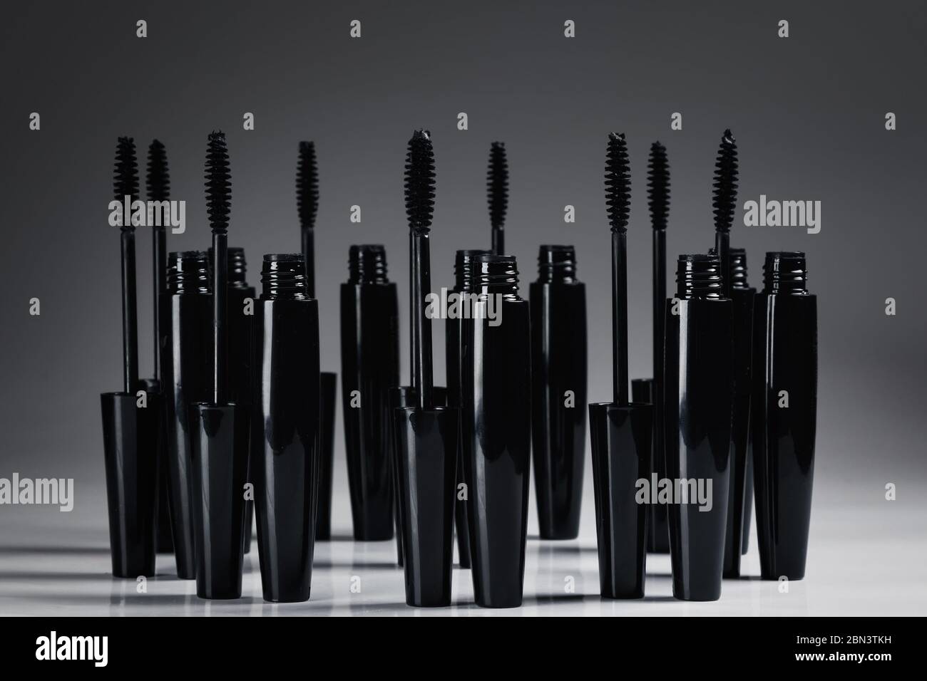 Mascara brushes and containers on white background Stock Photo