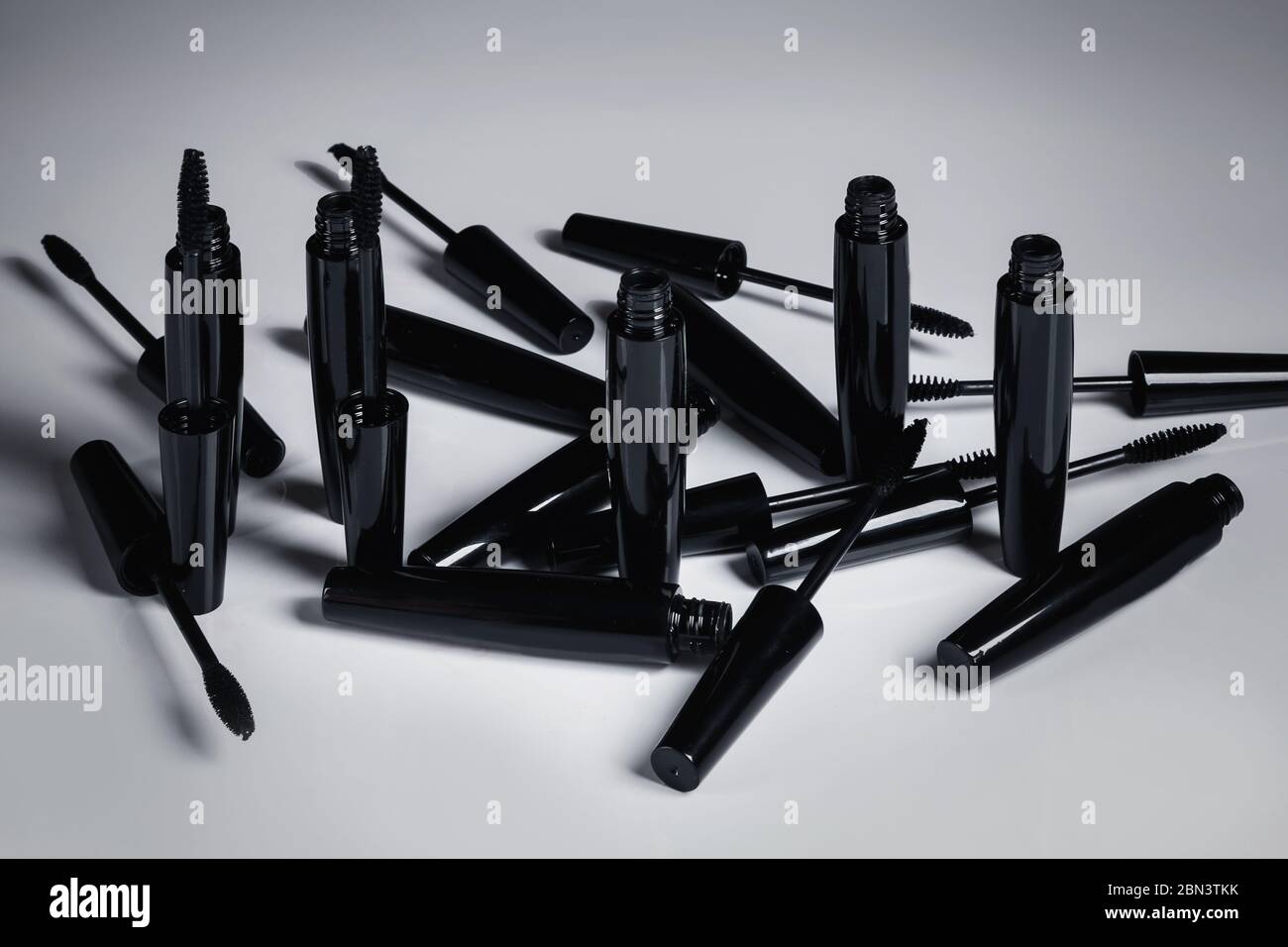 Mascara brushes and containers on white background Stock Photo