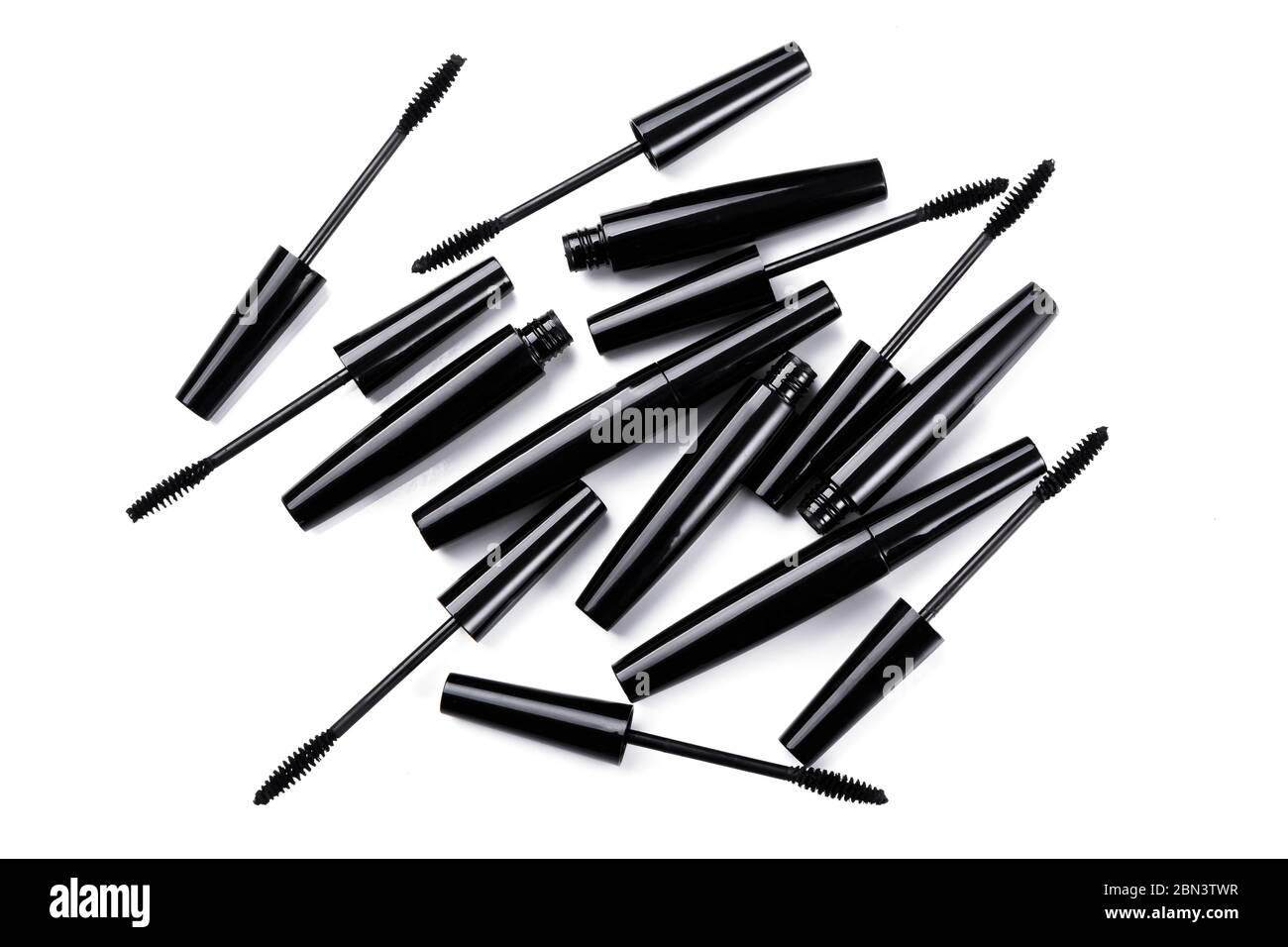 Mascara brushes and containers on white background Stock Photo