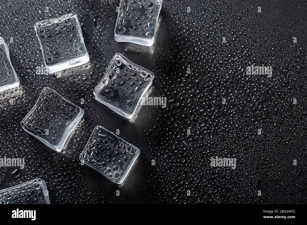 Colored banner with fresh ice cubes and reflections Stock Photo