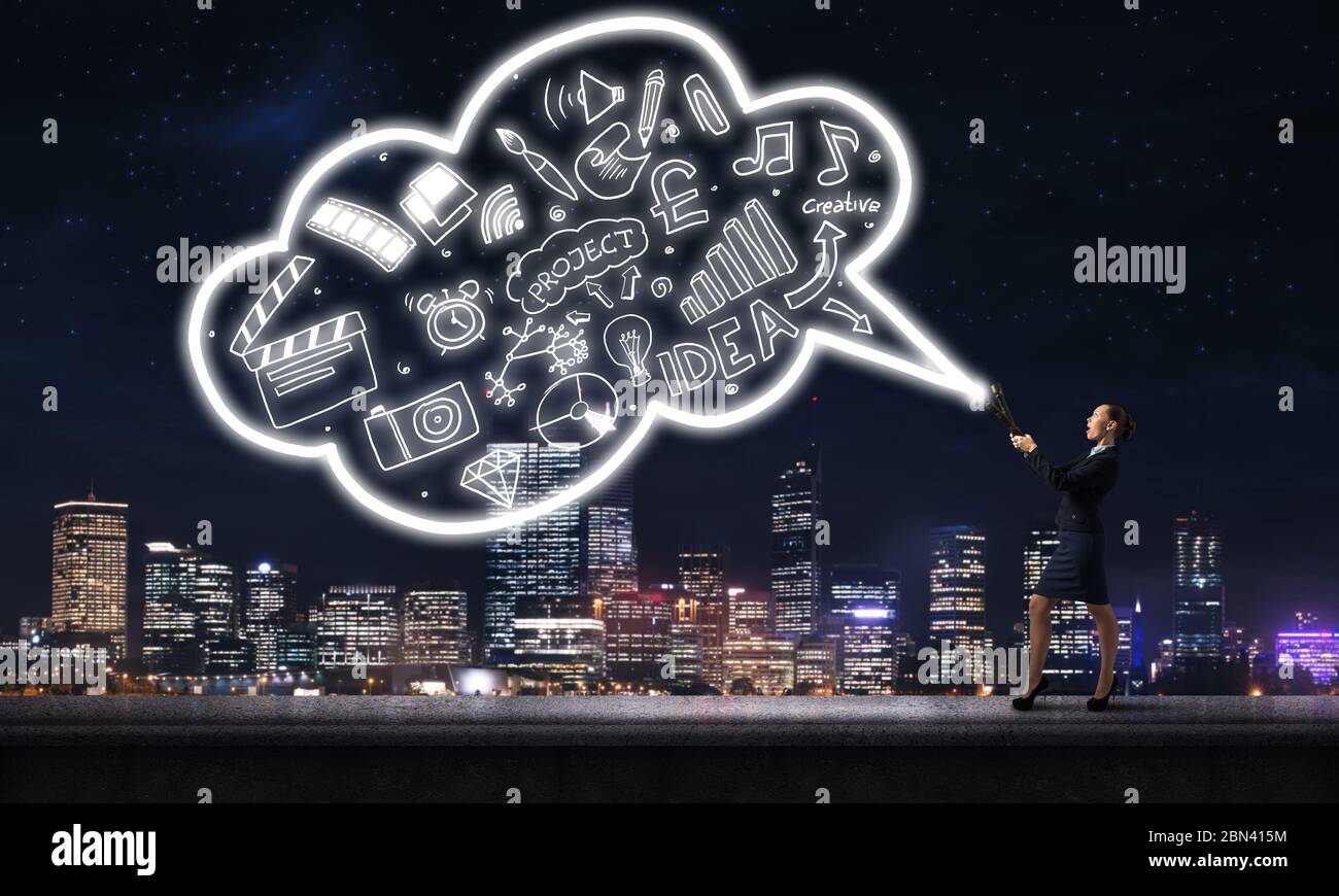 Woman throwing light on her ideas Stock Photo Alamy