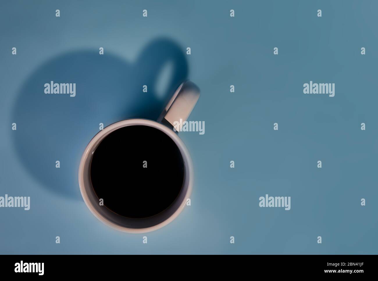 Cup of coffee, background blue Stock Photo - Alamy